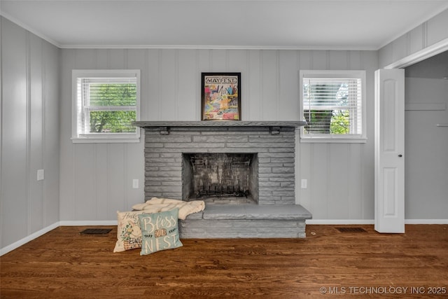 507 W Quincy St, Broken Arrow, OK 74012 - unfurnished living room with plenty of natural light, wood finished floors, baseboards, a brick fireplace, and ornamental molding