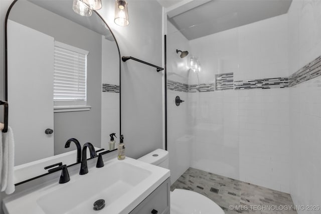 507 W Quincy St, Broken Arrow, OK 74012 - bathroom with toilet, tiled shower, and vanity