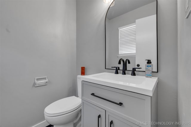 507 W Quincy St, Broken Arrow, OK 74012 - bathroom with vanity, toilet, and baseboards