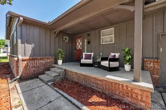 507 W Quincy St, Broken Arrow, OK 74012 - property entrance featuring board and batten siding and a porch