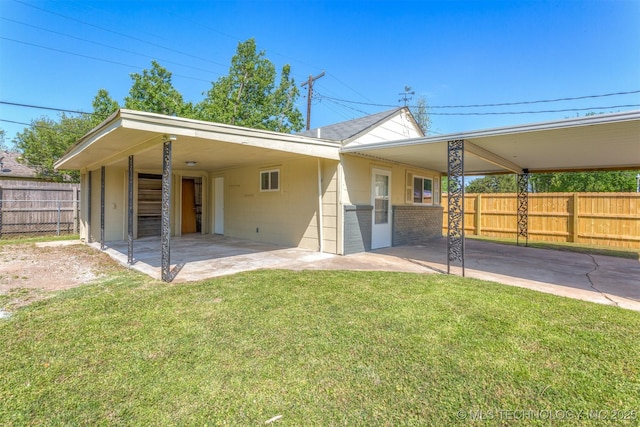 3224 S Darlington Ave, Tulsa, OK 74135 - view of front of home with a patio area, a front lawn, fence, and a carport