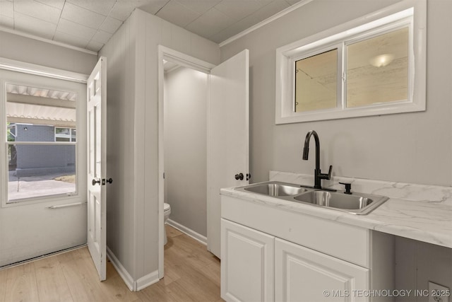 3224 S Darlington Ave, Tulsa, OK 74135 - bathroom with toilet, ornamental molding, vanity, and wood finished floors
