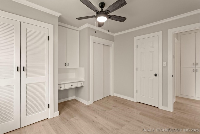 3224 S Darlington Ave, Tulsa, OK 74135 - unfurnished bedroom featuring light wood finished floors, a ceiling fan, multiple closets, baseboards, and ornamental molding