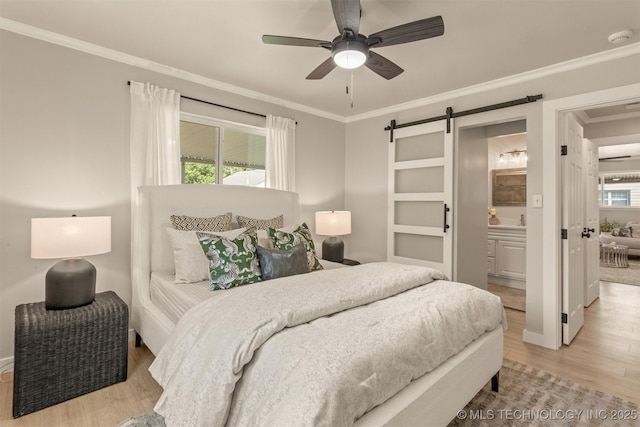 3224 S Darlington Ave, Tulsa, OK 74135 - bedroom with light wood-type flooring, a barn door, ceiling fan, ensuite bath, and ornamental molding