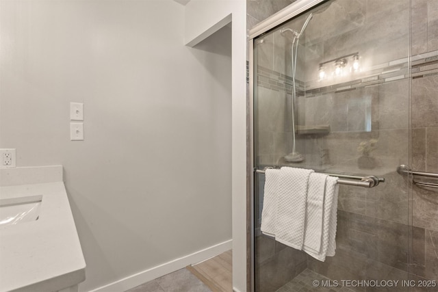 3224 S Darlington Ave, Tulsa, OK 74135 - bathroom featuring a stall shower, vanity, and baseboards