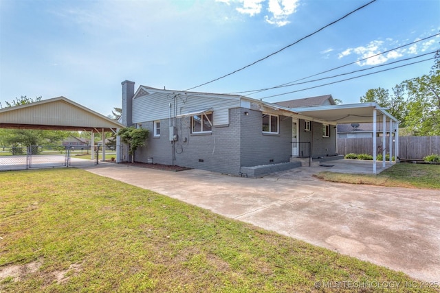 3224 S Darlington Ave, Tulsa, OK 74135 - exterior space featuring a yard, brick siding, a gate, and crawl space