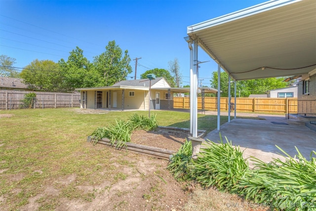 3224 S Darlington Ave, Tulsa, OK 74135 - view of yard featuring a patio area and a fenced backyard
