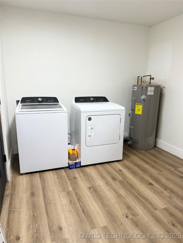 clothes washing area with water heater, laundry area, light wood-style floors, baseboards, and separate washer and dryer