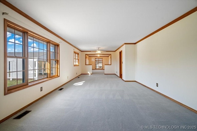 509 NE 10th St, Wagoner, OK 74467 - unfurnished living room with light carpet, baseboards, and visible vents
