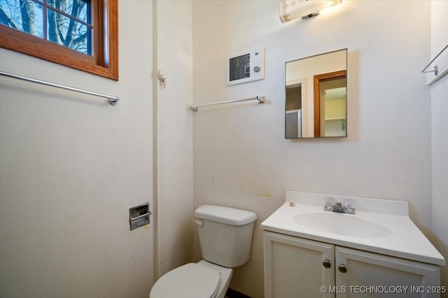 509 NE 10th St, Wagoner, OK 74467 - bathroom with toilet, vanity, and visible vents