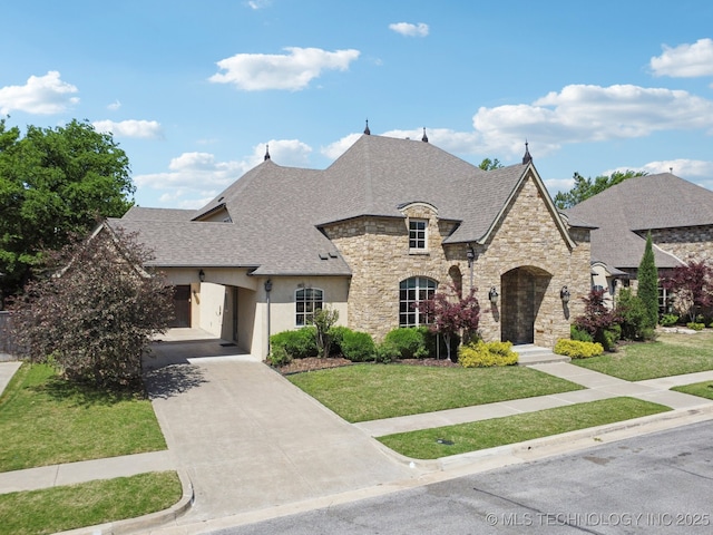 10626 S Joplin Ave, Tulsa, OK 74137 - french provincial home with stone siding, a front yard, roof with shingles, stucco siding, and driveway