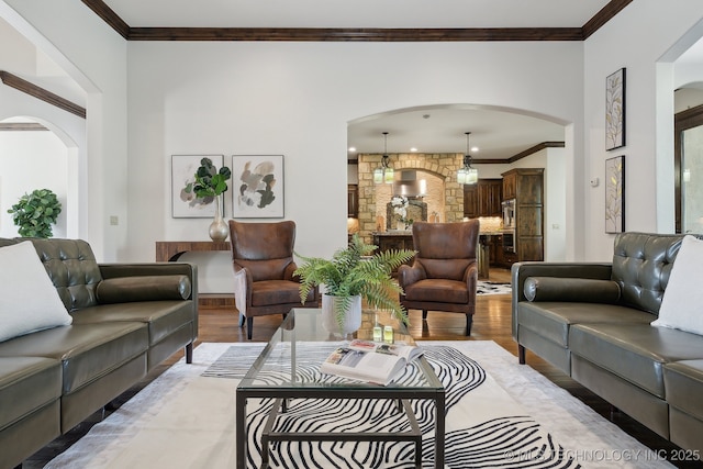 10626 S Joplin Ave, Tulsa, OK 74137 - living area featuring arched walkways, light wood finished floors, and ornamental molding