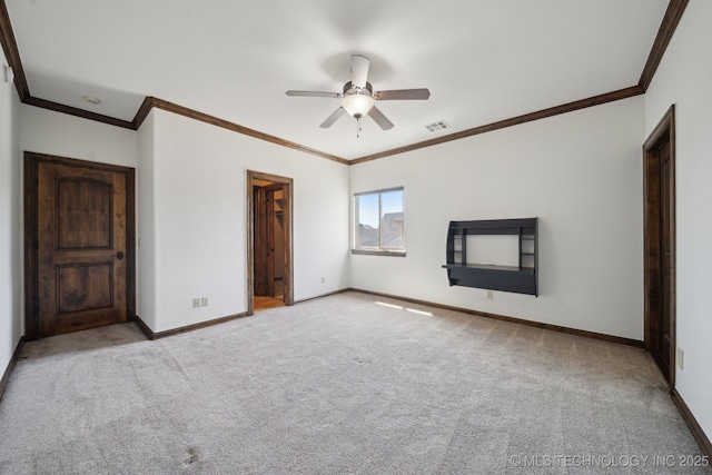 10626 S Joplin Ave, Tulsa, OK 74137 - unfurnished bedroom with carpet flooring, crown molding, baseboards, a ceiling fan, and a walk in closet