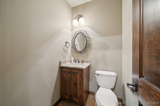 10626 S Joplin Ave, Tulsa, OK 74137 - bathroom with toilet, vanity, baseboards, and tile patterned floors
