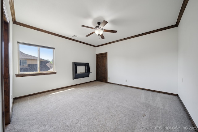 10626 S Joplin Ave, Tulsa, OK 74137 - spare room with carpet flooring, baseboards, crown molding, and ceiling fan