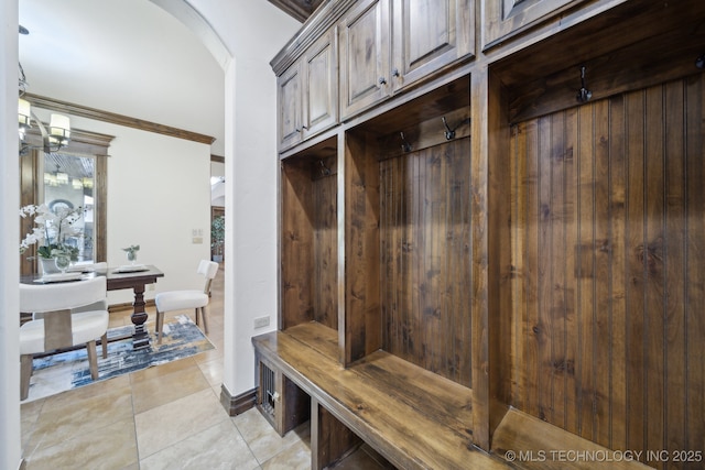 10626 S Joplin Ave, Tulsa, OK 74137 - mudroom with arched walkways, ornamental molding, a sauna, light tile patterned floors, and baseboards