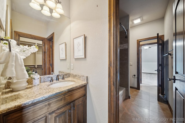 10626 S Joplin Ave, Tulsa, OK 74137 - bathroom with vanity, tile patterned flooring, and a chandelier