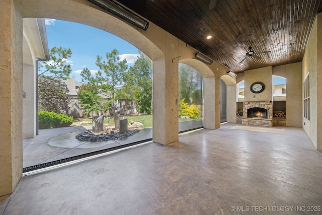 10626 S Joplin Ave, Tulsa, OK 74137 - view of patio with an outdoor stone fireplace