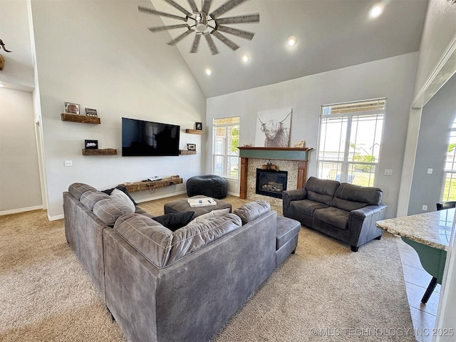 1412 Richmond Dr, Fort Gibson, OK 74434 - living room with light carpet, a glass covered fireplace, recessed lighting, a ceiling fan, and high vaulted ceiling