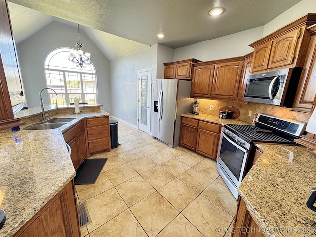 1412 Richmond Dr, Fort Gibson, OK 74434 - kitchen featuring stainless steel appliances, a sink, vaulted ceiling, decorative backsplash, and light stone counters
