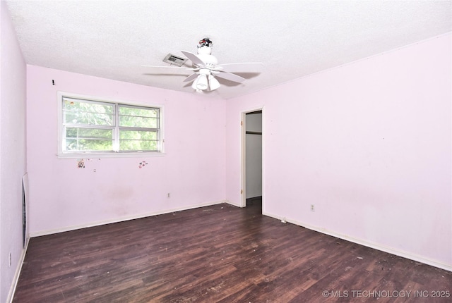 6903 E 63rd St, Tulsa, OK 74133 - empty room featuring wood finished floors, ceiling fan, baseboards, and a textured ceiling