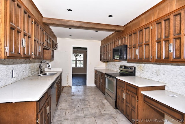 6903 E 63rd St, Tulsa, OK 74133 - kitchen with appliances with stainless steel finishes, a sink, tasteful backsplash, baseboards, and ornamental molding