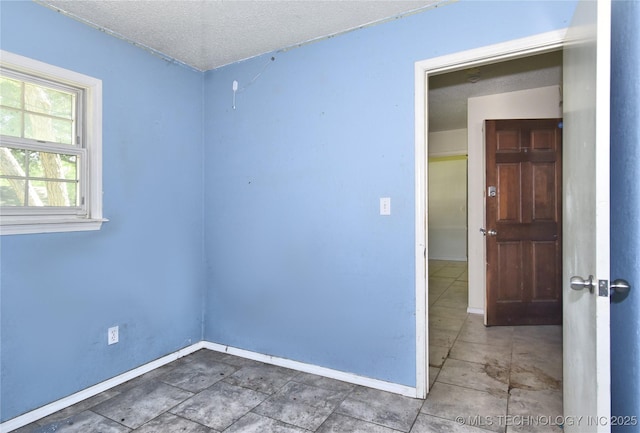 6903 E 63rd St, Tulsa, OK 74133 - empty room with baseboards and a textured ceiling