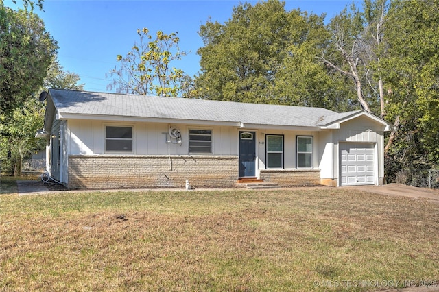 ranch-style house with roof with shingles, a garage, brick siding, board and batten siding, and a front yard