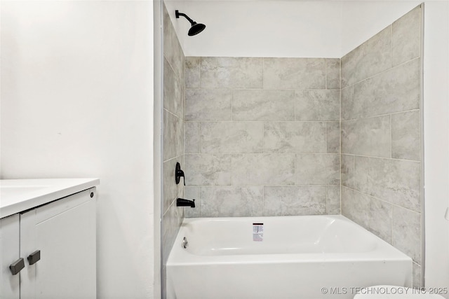 bathroom with vanity and  shower combination