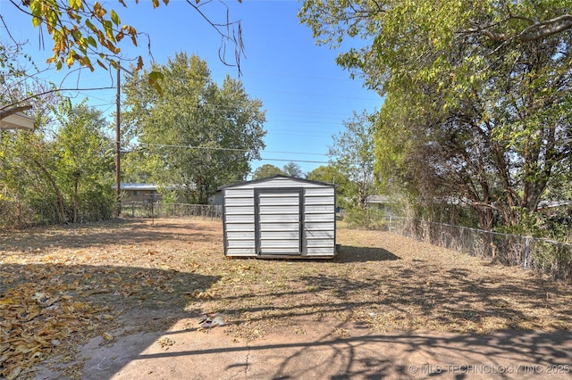 view of shed featuring a fenced backyard