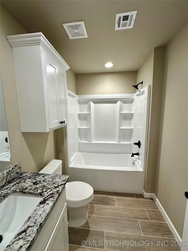 full bath with vanity, toilet, wood finish floors, and visible vents
