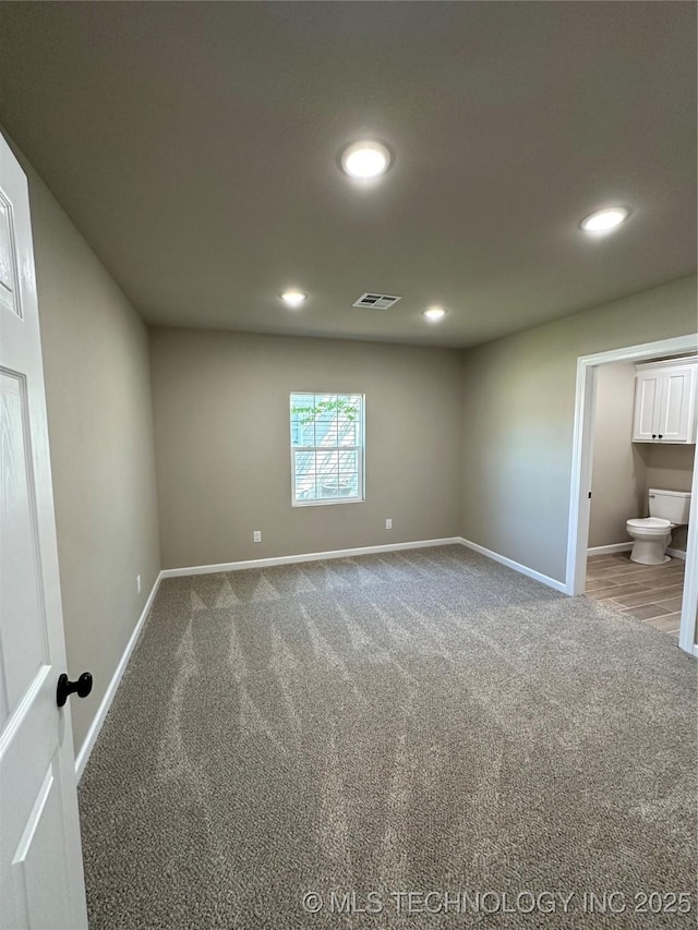 interior space featuring recessed lighting, visible vents, and baseboards