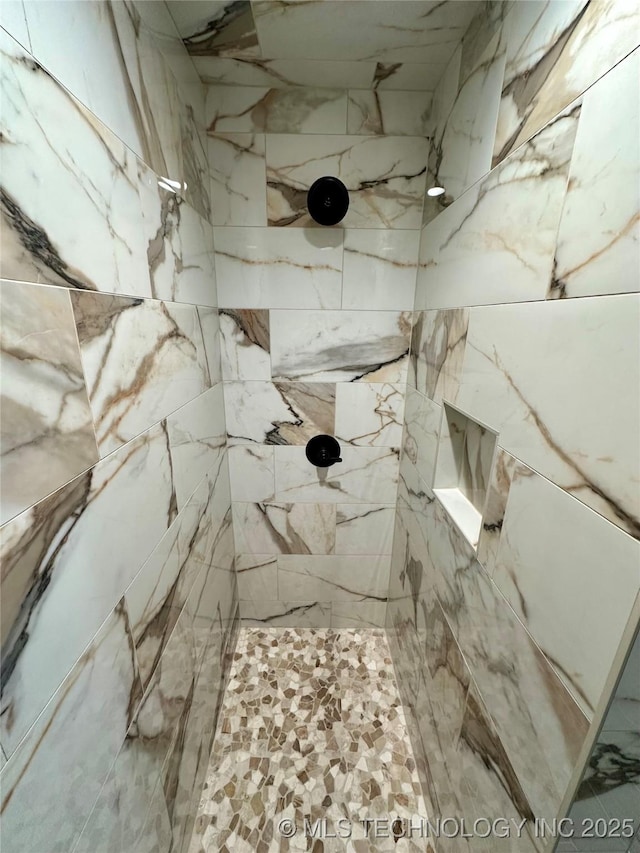 interior space featuring a tile shower