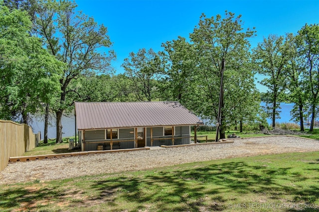 exterior space with a lawn and fence
