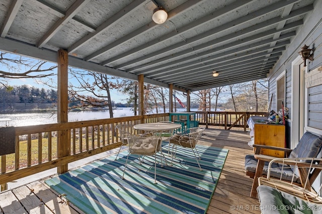 wooden deck with a water view