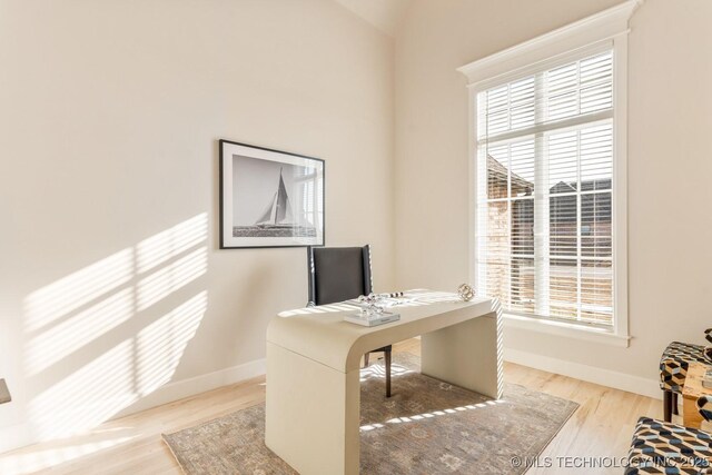 office with wood finished floors, a wealth of natural light, and baseboards