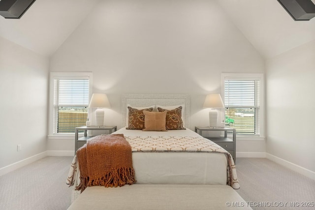 bedroom with baseboards, high vaulted ceiling, and light colored carpet