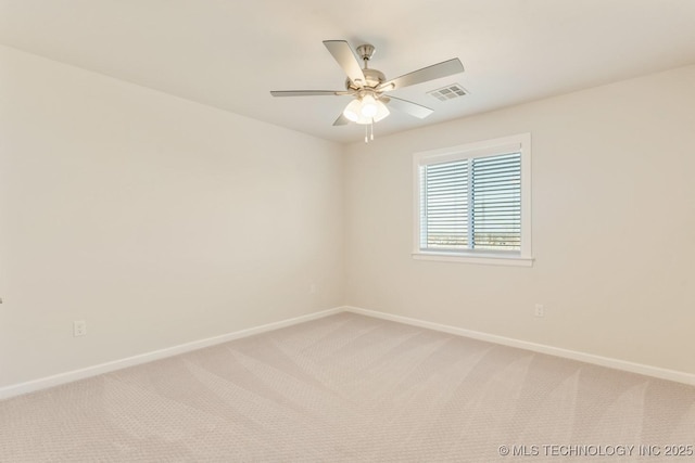 unfurnished room with visible vents, baseboards, ceiling fan, and light colored carpet