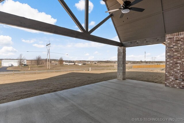 view of patio with fence and ceiling fan