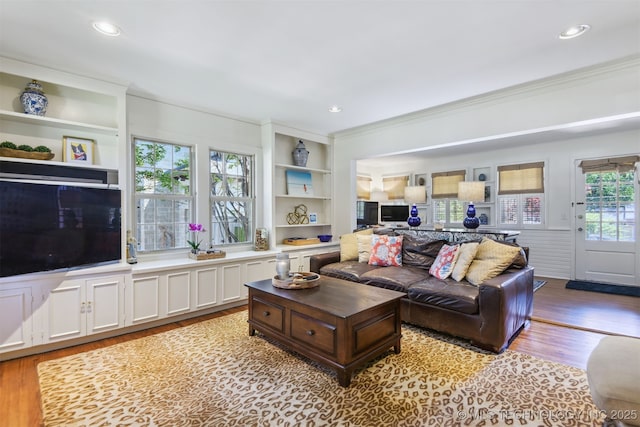 2412 E 23rd St, Tulsa, OK 74114 - living room featuring wood finished floors, recessed lighting, and crown molding