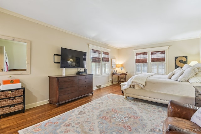 2412 E 23rd St, Tulsa, OK 74114 - bedroom with visible vents, baseboards, wood finished floors, and ornamental molding