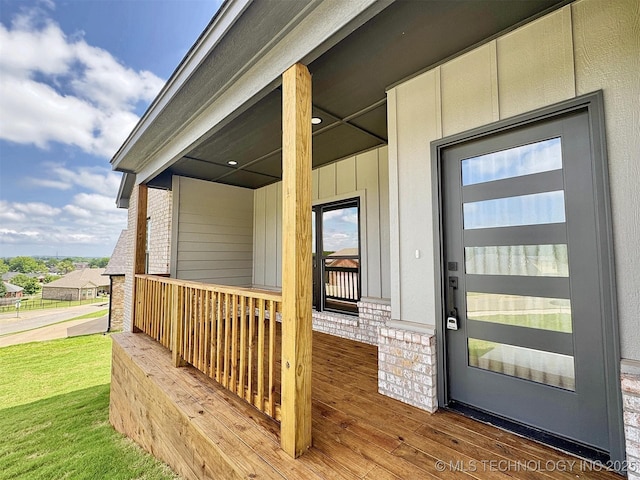 574 Woodlands Dr, Tahlequah, OK 74464 - property entrance featuring covered porch and brick siding