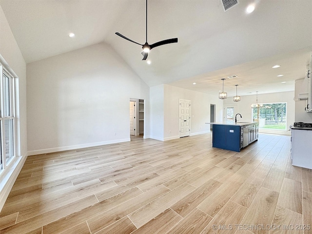 574 Woodlands Dr, Tahlequah, OK 74464 - unfurnished living room with a sink, a ceiling fan, light wood finished floors, recessed lighting, and lofted ceiling