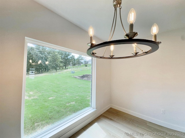 574 Woodlands Dr, Tahlequah, OK 74464 - detailed view of a chandelier, wood finished floors, and baseboards