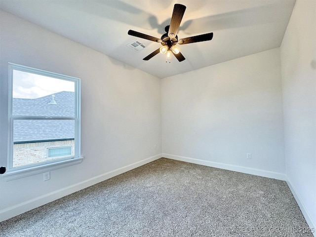 574 Woodlands Dr, Tahlequah, OK 74464 - empty room featuring plenty of natural light, a ceiling fan, and carpet