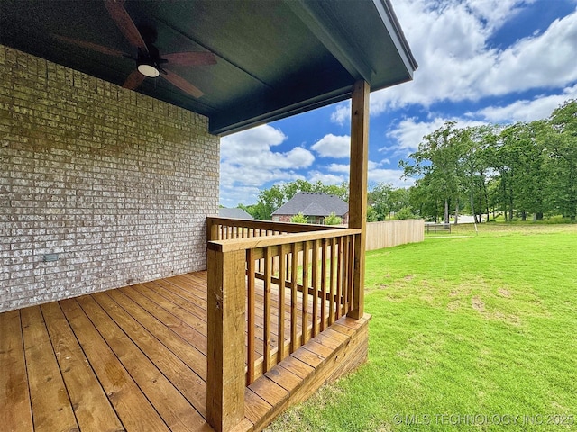 574 Woodlands Dr, Tahlequah, OK 74464 - wooden terrace featuring a ceiling fan and a lawn
