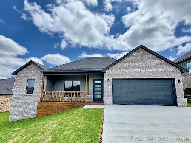 574 Woodlands Dr, Tahlequah, OK 74464 - view of front of house featuring brick siding, a garage, driveway, and a front lawn