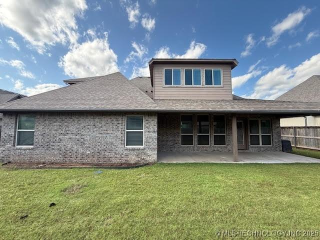 7056 E 124th St S, Bixby, OK 74008 - back of property featuring a patio area, roof with shingles, and brick siding