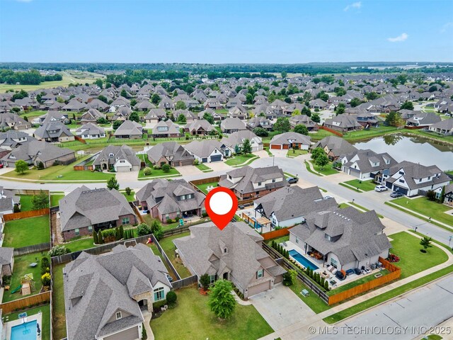 7056 E 124th St S, Bixby, OK 74008 - aerial view of residential area with a nearby body of water