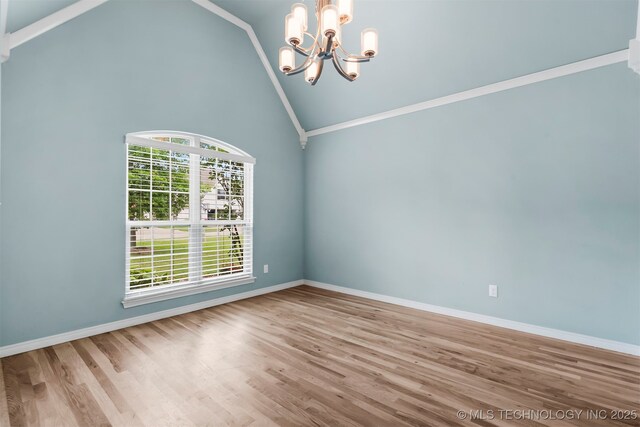 7056 E 124th St S, Bixby, OK 74008 - unfurnished room featuring a chandelier, wood finished floors, baseboards, and high vaulted ceiling